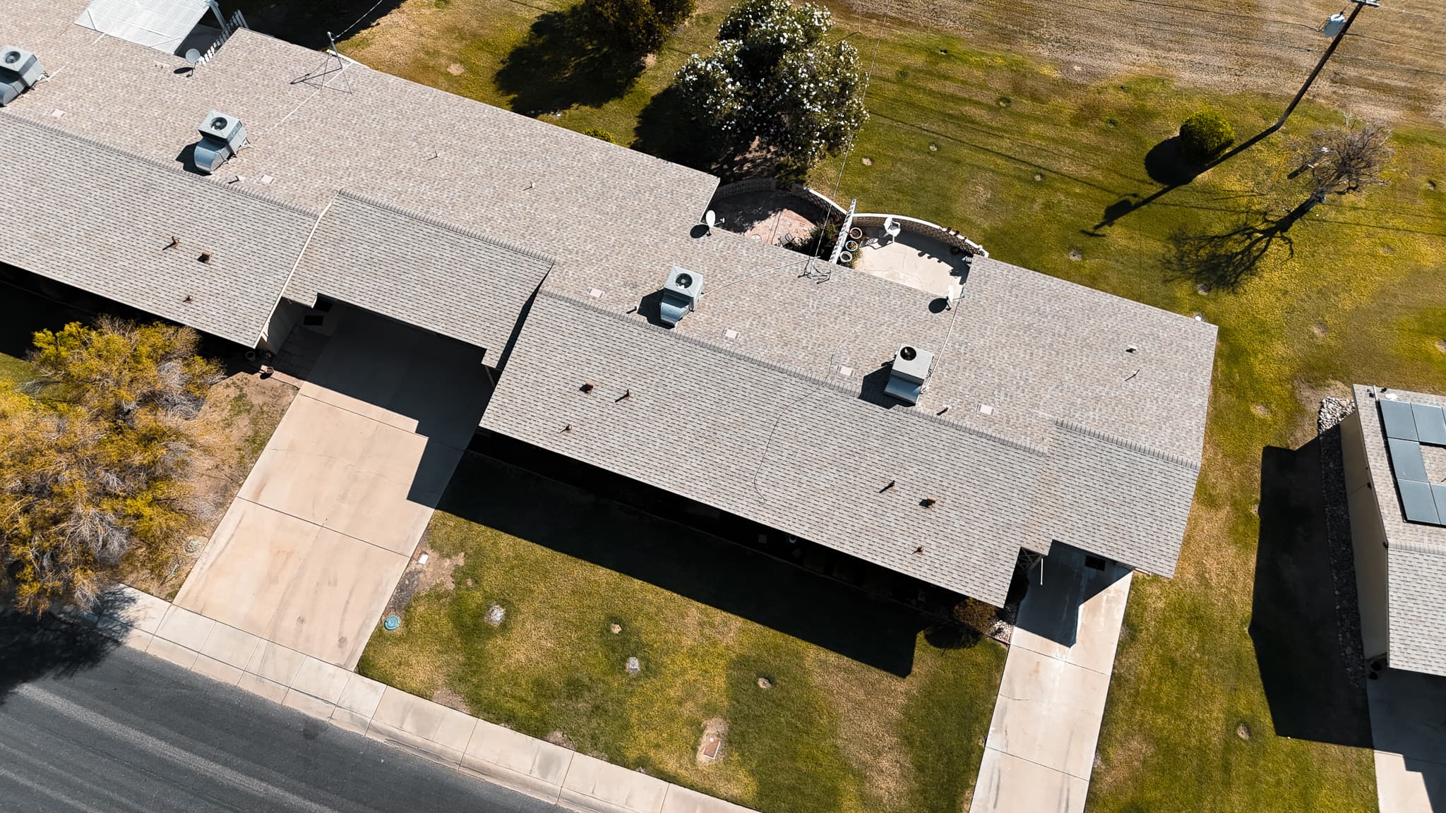 Aerial view of a Scottsdale pitched-roof neighborhood showing the typical concrete tile installation HailCo Roofing replaces across DC Ranch, McCormick Ranch, and Grayhawk