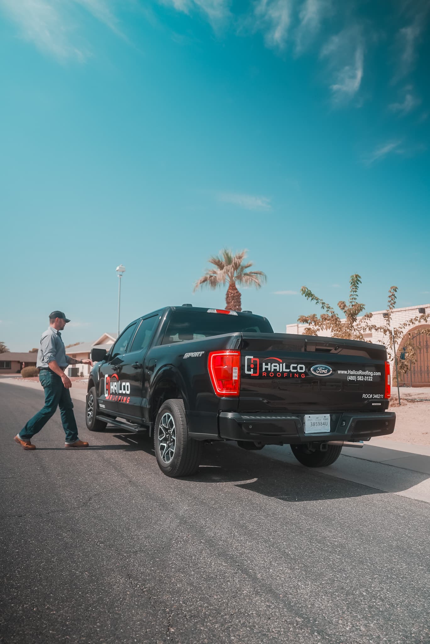 HailCo Roofing branded truck arriving at a Phoenix Valley residential project
