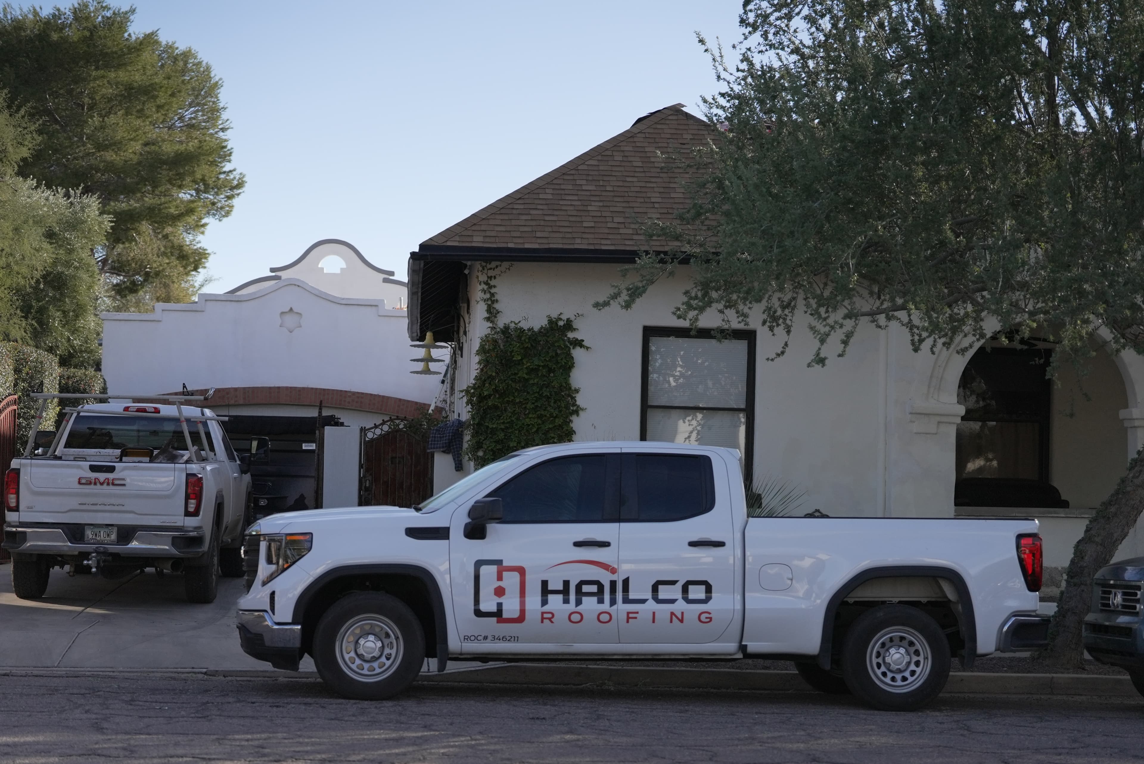 HailCo Roofing branded truck parked at a Phoenix Valley residential job site for a free roof inspection
