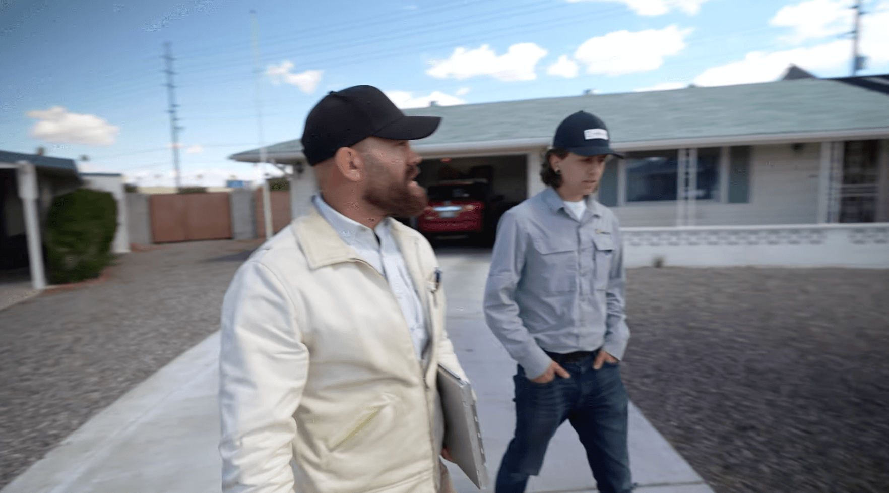 HailCo Roofing owners arriving at an Arizona home for monsoon emergency response