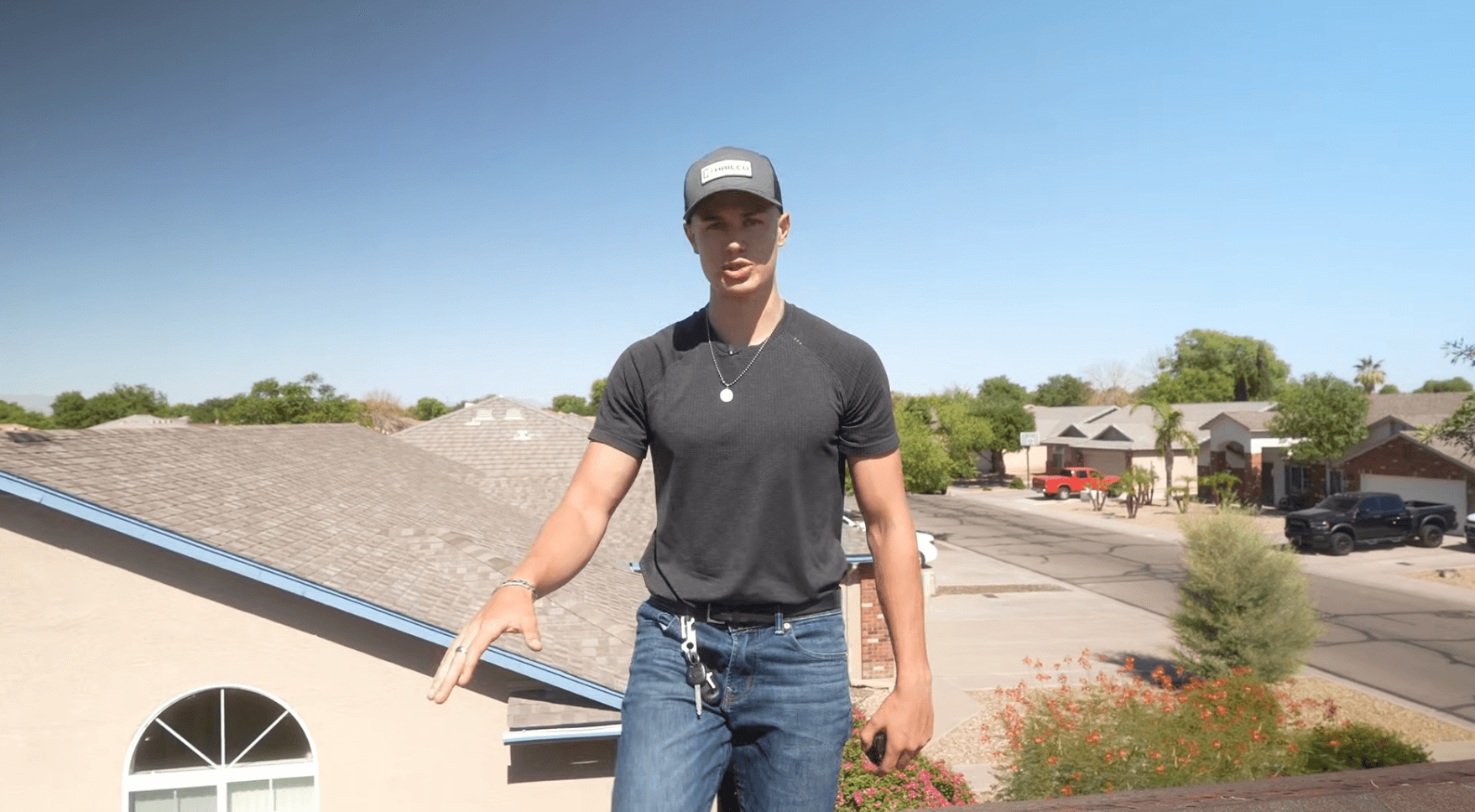 HailCo Roofing co-owner on a Phoenix-Valley residential roof during a customer inspection
